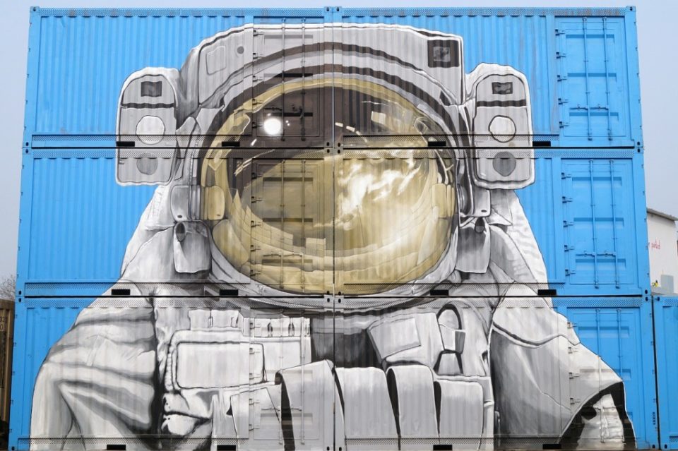 Astronaut painted across multiple shipping containers