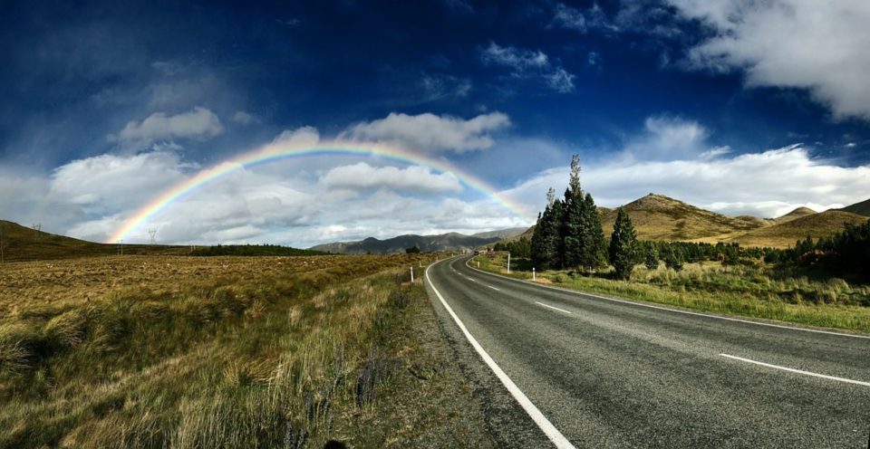 Rainbow over an open road
