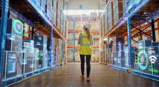 A warehouse worker uses technology for better visibility into her warehouse products