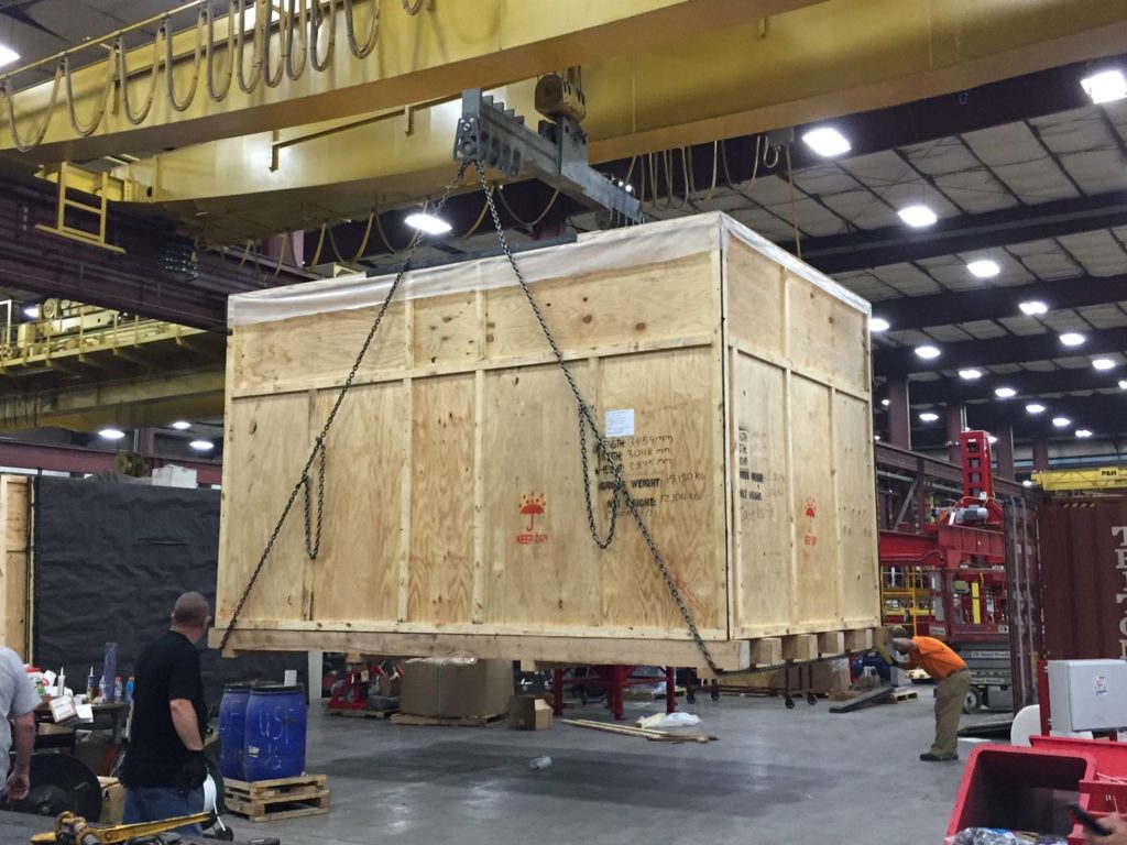 A custom crate is lifted for transport