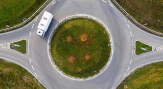 Birds eye view of a truck in a roundabout, representing circular supply chains